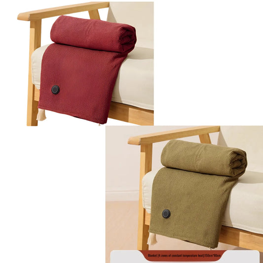 Cream USB heated throw draped over an armchair