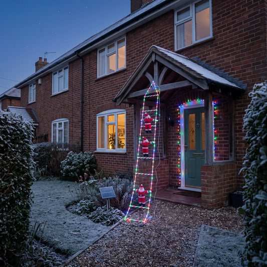 Solar climbing Santa ladder lights on the porch of a brick house at dusk