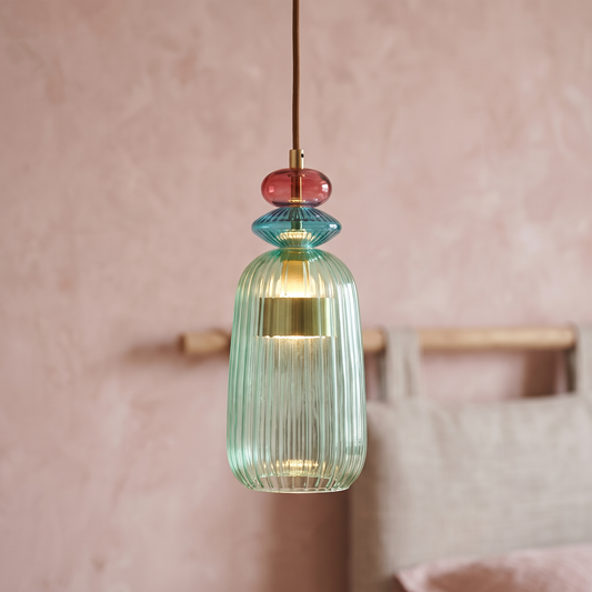 Green ribbed glass mini pendant light, close-up in a bedroom