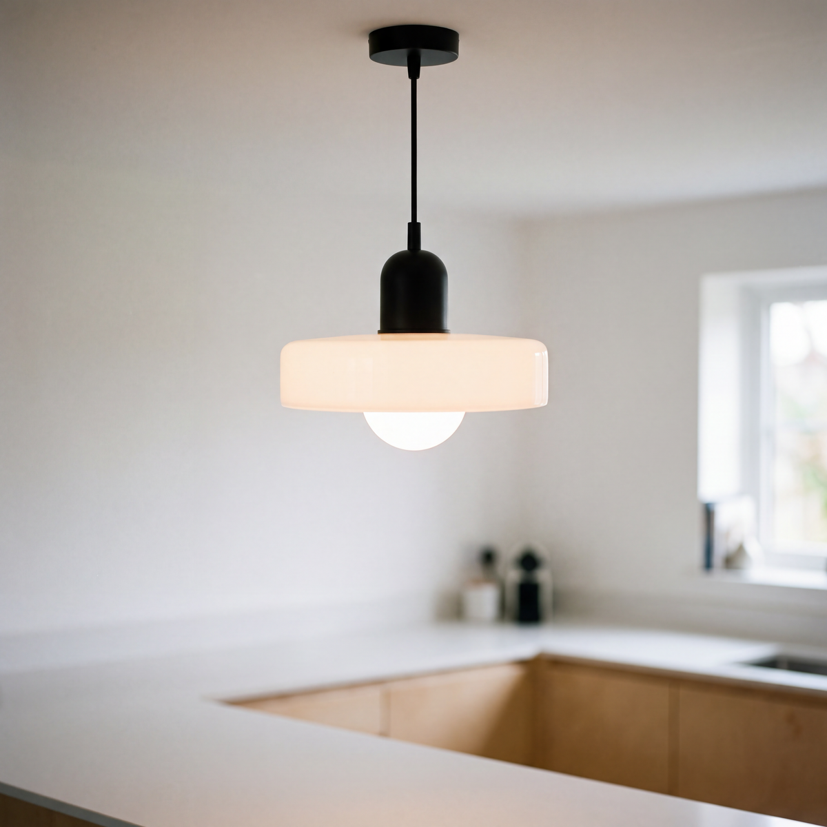 Bauhaus coloured glass pendant light over a kitchen counter
