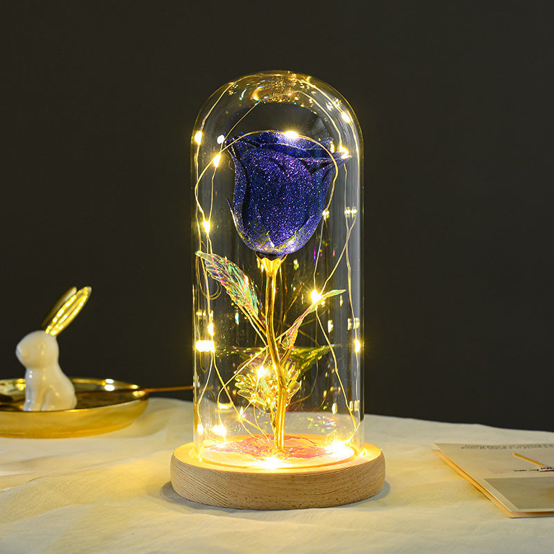 Rose glass dome night light wooden base close-up