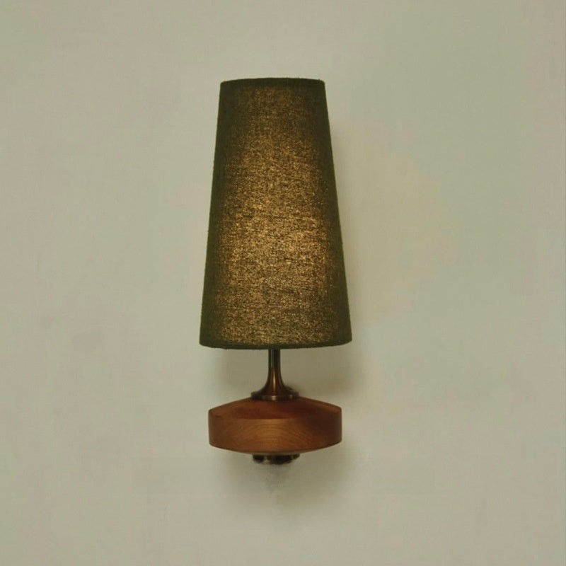 Green fabric wall light on a sage wall