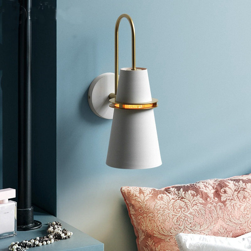 White cone wall light in a hallway
