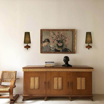 Pair of fabric wall lights either side of a picture above a sideboard