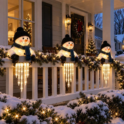 Light up snowman decorations with icicle lights on a porch railing