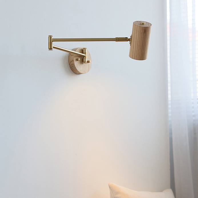 Natural wood swing arm wall light with brass arm