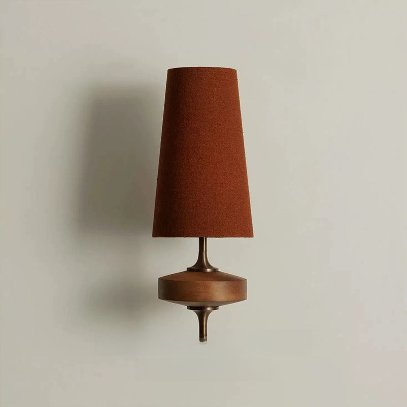 Rust red fabric wall light with tall shade and wooden base