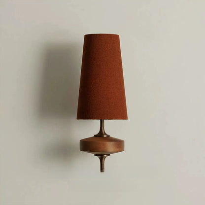 Rust red fabric wall light with tall shade and wooden base