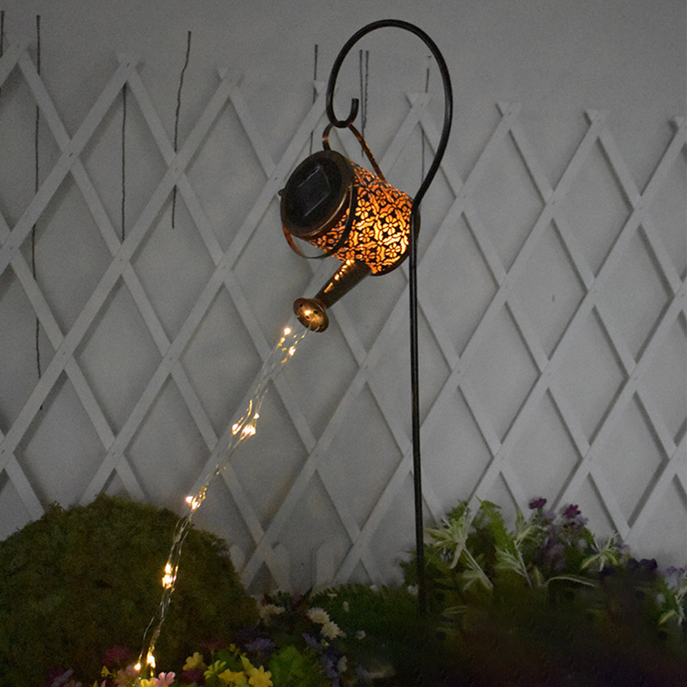 Solar watering can garden light with LED shower effect at night