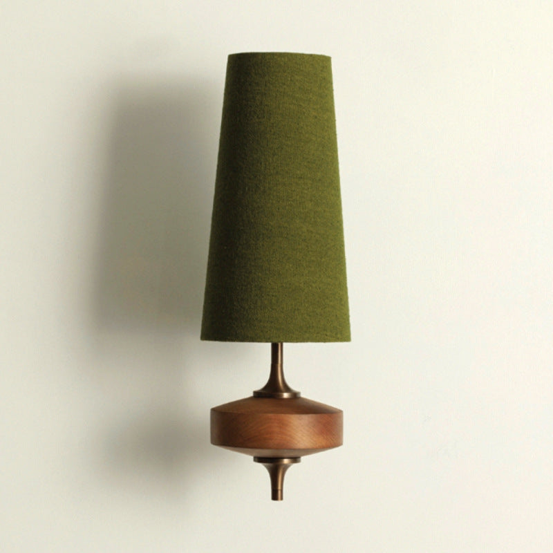 Green fabric wall light with tall shade and wooden base