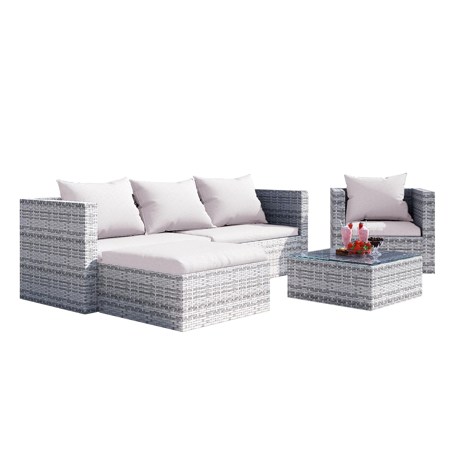4 seater rattan set in garden with plants background
