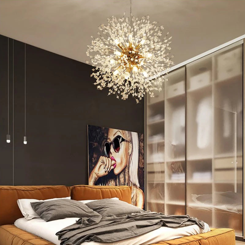 Gold firework crystal chandelier above a bed in a warm bedroom