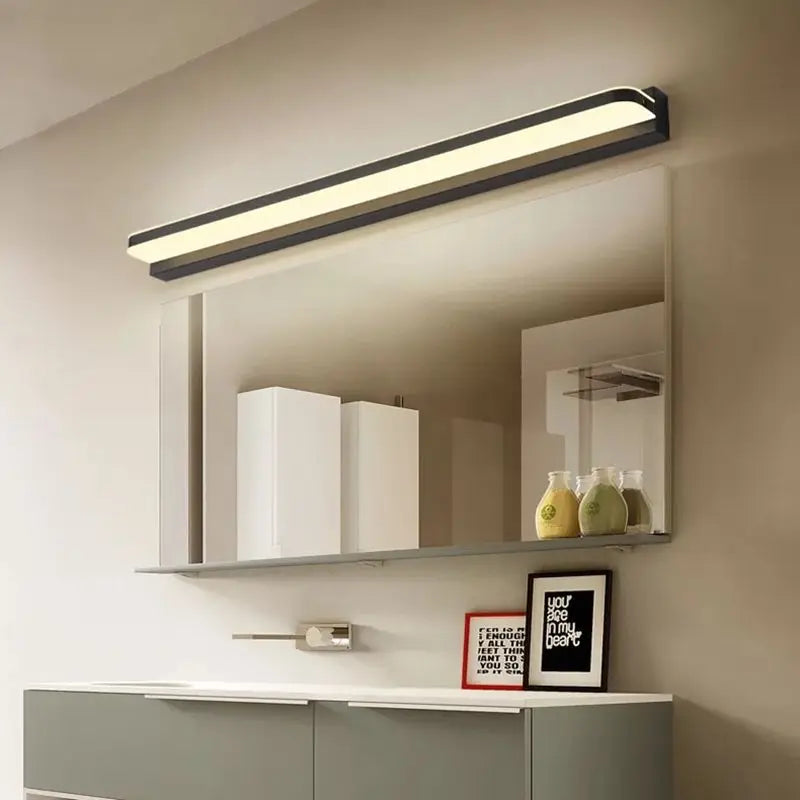 Bathroom mirror light installed above vanity unit