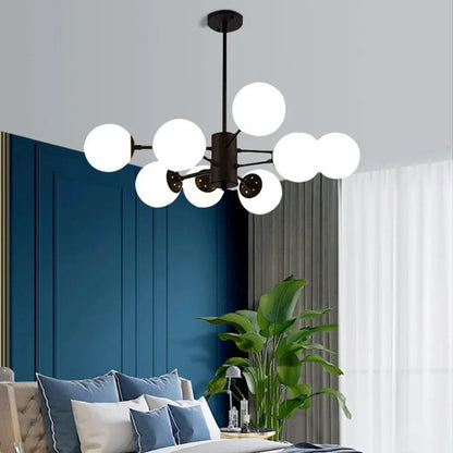 Black glass globe chandelier above a bedroom with a navy feature wall