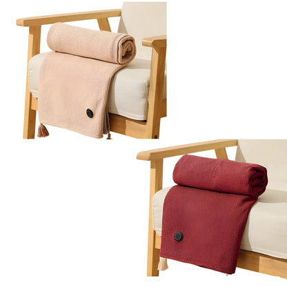Burgundy electric heated shawl blanket folded on a wooden bench