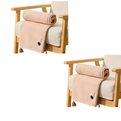 Cream wearable heated cape blanket draped over a chair back