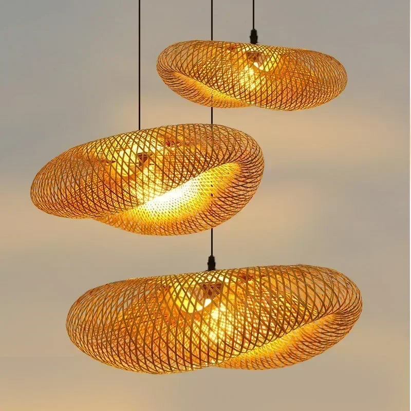 Hand woven bamboo pebble pendant lights hung at staggered heights