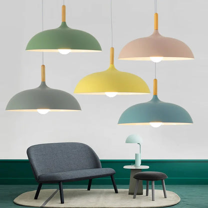 Nordic macaron dome pendant light with oak wood stem hanging over a dining table