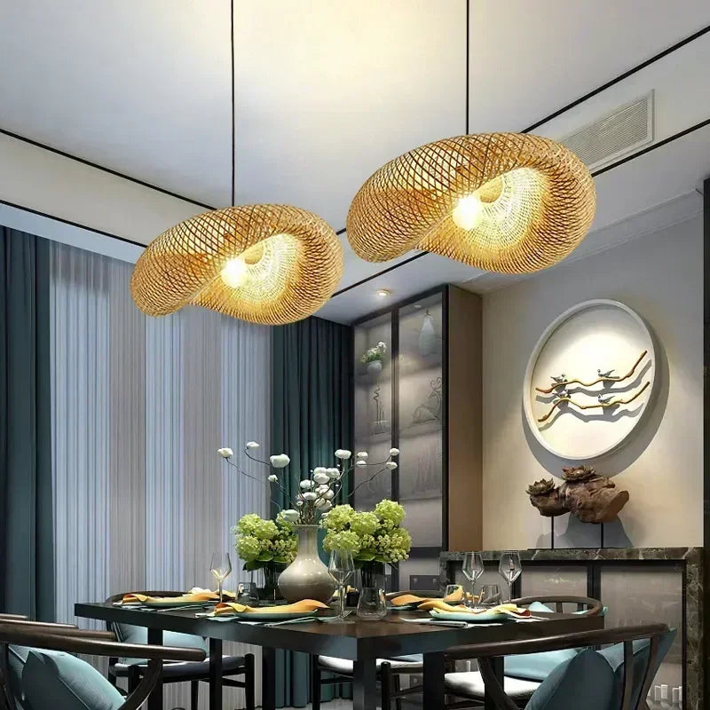 Woven bamboo pendant lights above a dining table in a modern room