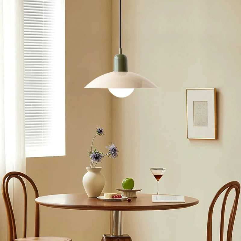 Two tone saucer pendant light in a bright kitchen