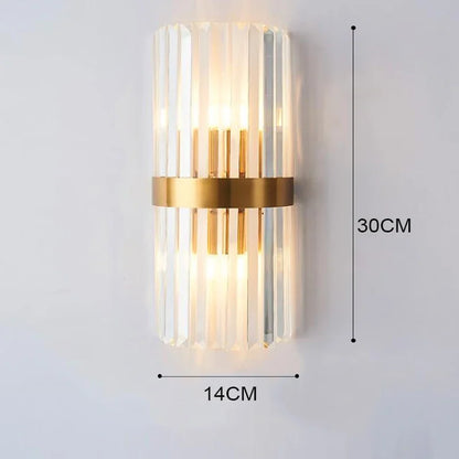 Gold crystal wall light paired beside bedroom mirror