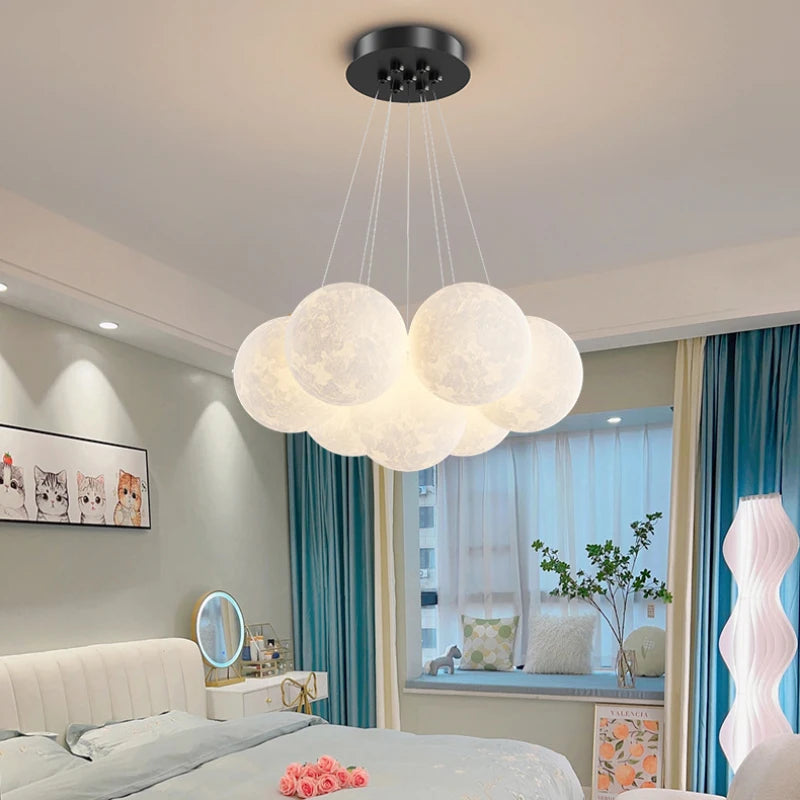 Moon lamp cluster chandelier in a children's bedroom at night