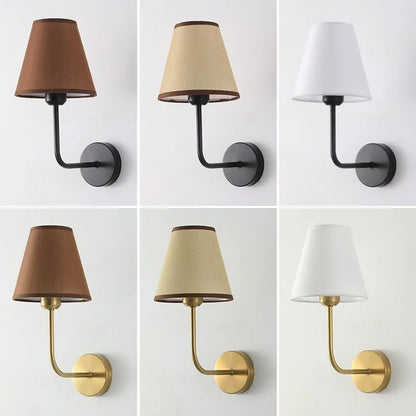 Fabric wall sconce warm glow living room setting