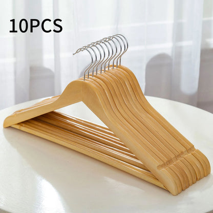 Solid wood hangers in organised wardrobe setting