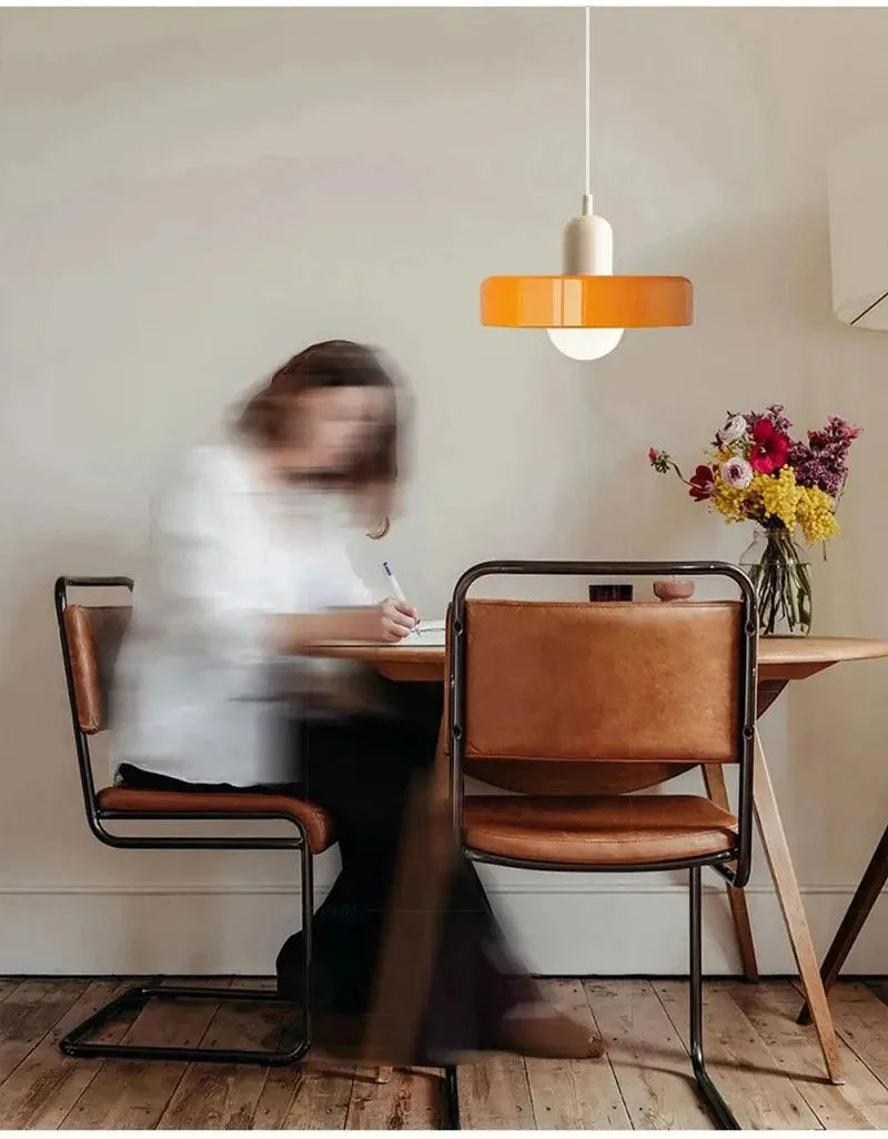 Terracotta and orange fluted glass pendant light in a modern dining room