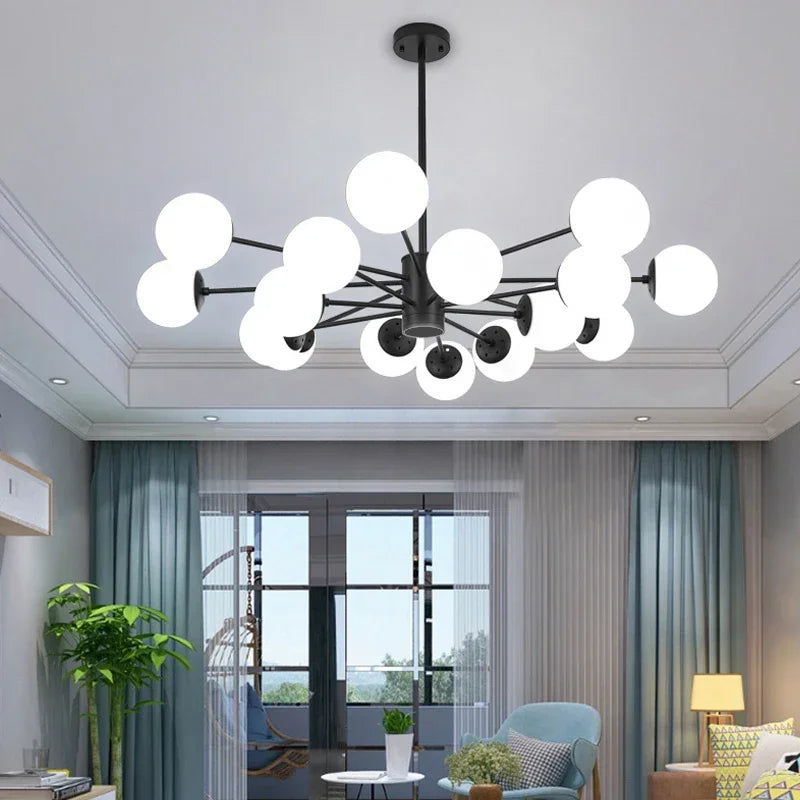 Black frame glass globe chandelier in a bright open plan living room