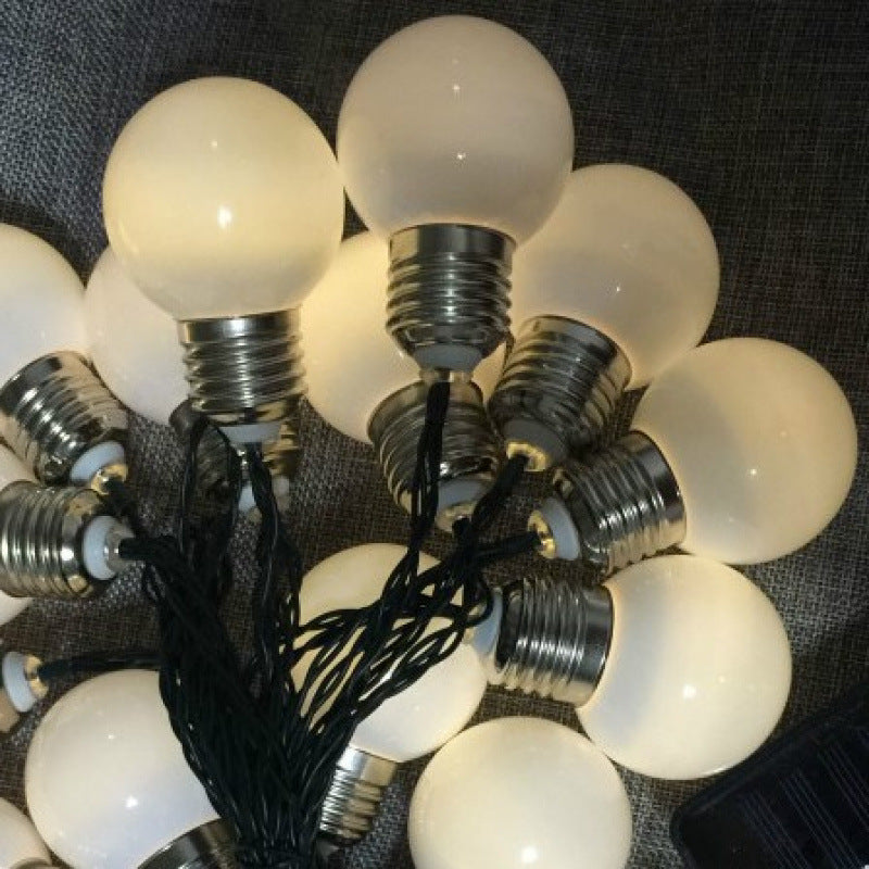 Warm white solar fairy lights wrapped around garden trellis