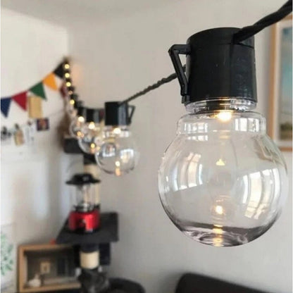 Waterproof IP65 solar string lights draped on garden fence