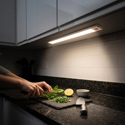 LED under cabinet light strip illuminating a kitchen countertop at night
