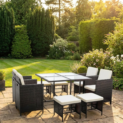 9 piece rattan garden furniture set lifestyle shot on stone patio in English garden