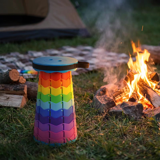 Folding stool lifestyle shot beside campfire at dusk