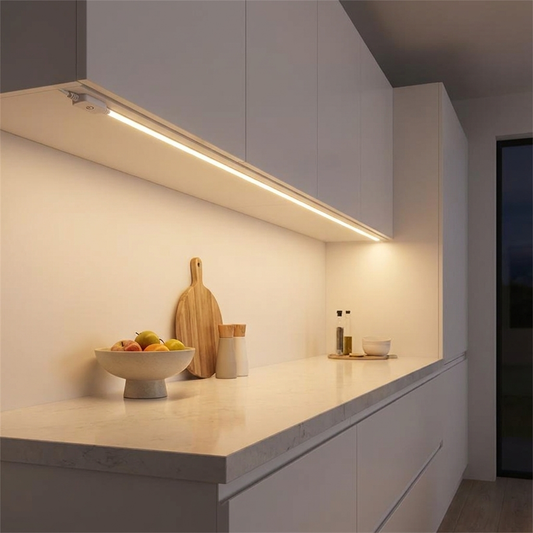 USB neon LED light strip flush mounted under white kitchen cabinets glowing warm white at night