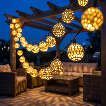 Warm white Moroccan solar string lights on a pergola at dusk