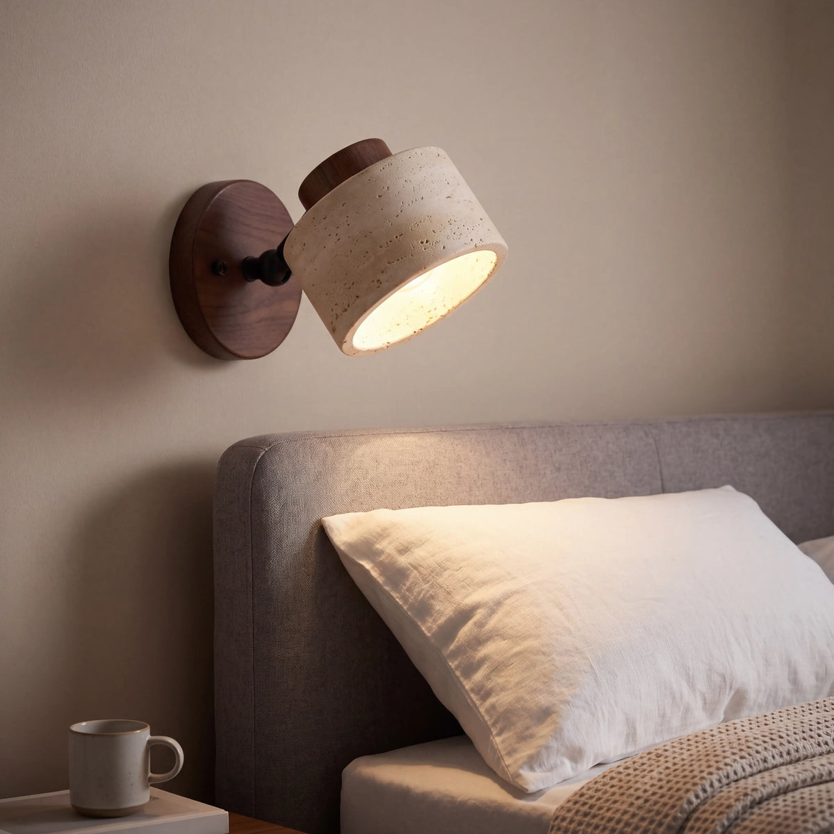 Rotatable yellow cave stone reading wall lamp with walnut arm, 12cm plate, wall mounted beside a UK bed