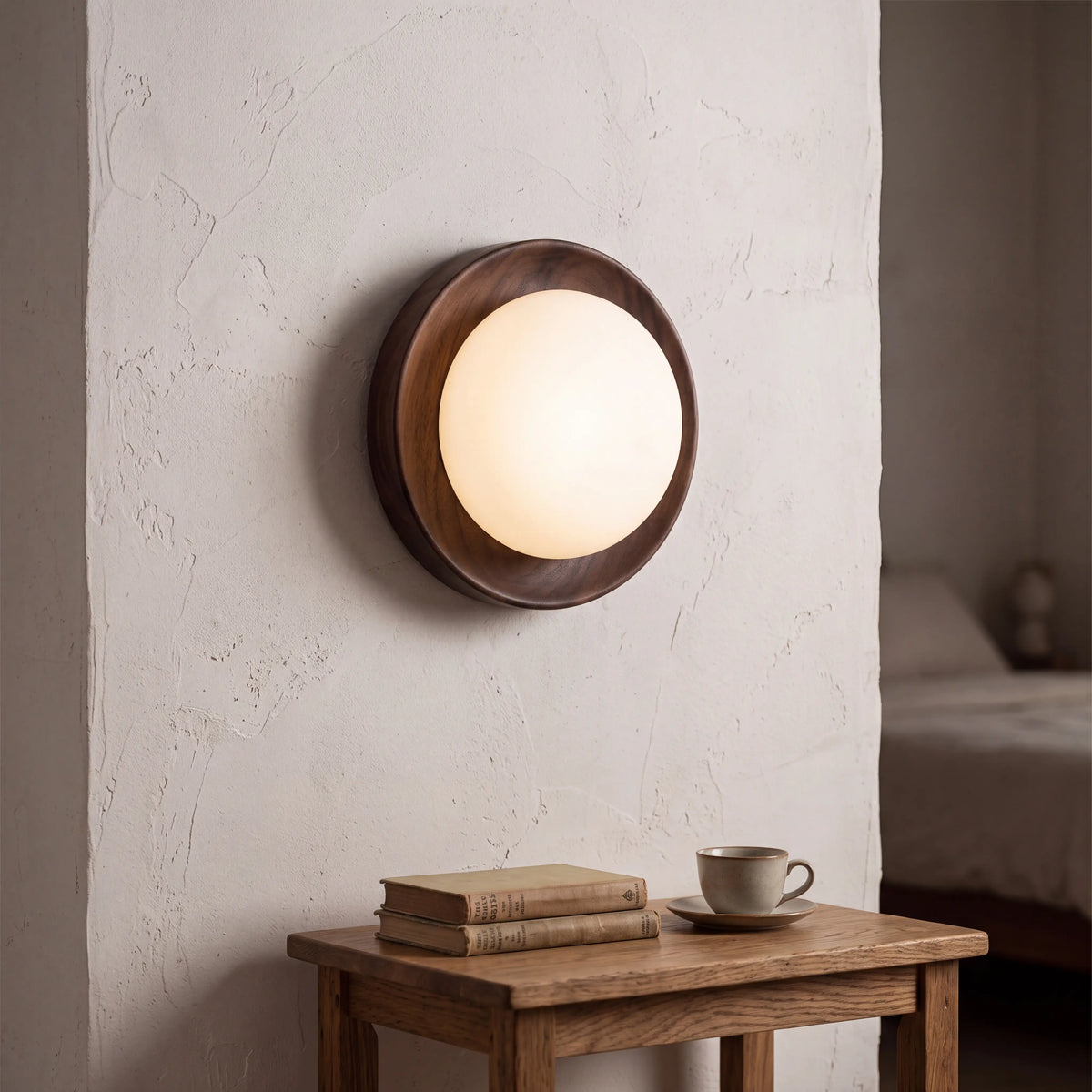 Round milky glass and walnut wood wall lamp, 17.5cm diameter, G4 LED wall light in a UK bedroom