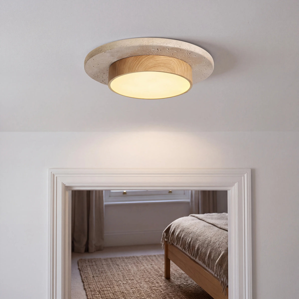 Warm yellow natural stone and wood flush ceiling light, 22cm diameter, surface mounted in a UK hallway
