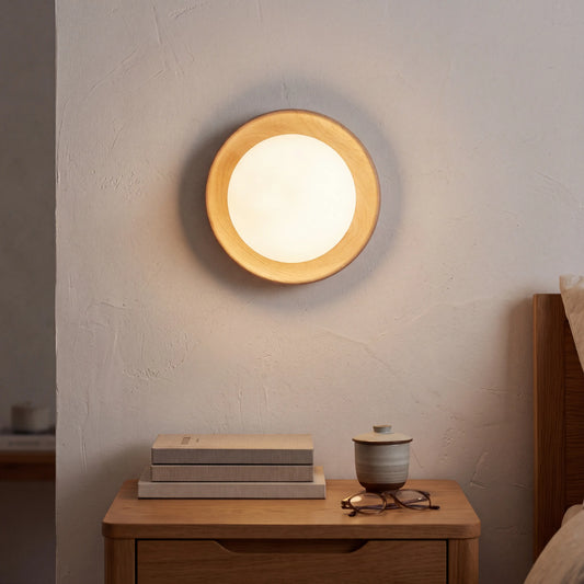 Round milky glass and natural wood wall lamp, 17.5cm diameter, G4 LED wall light in a UK hallway