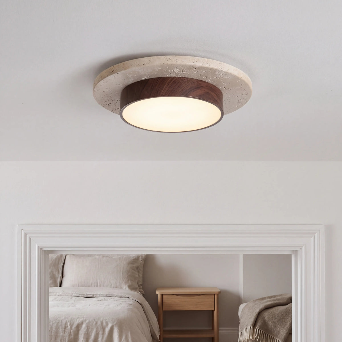 Warm brown natural stone and wood flush ceiling light, 22cm diameter, surface mounted in a UK bedroom