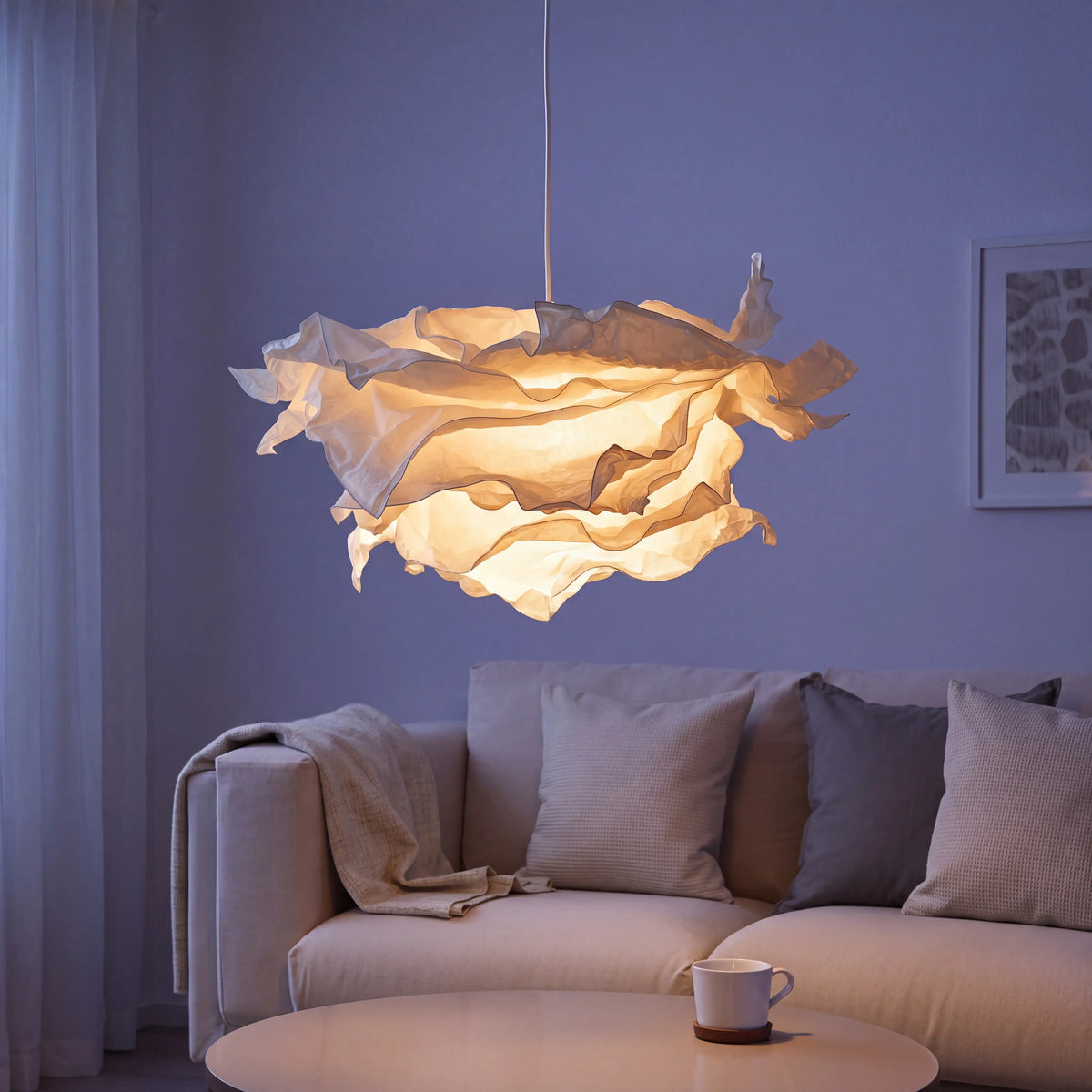 Fluffy white cloud lamp shade over a ceiling pendant in a UK children's bedroom
