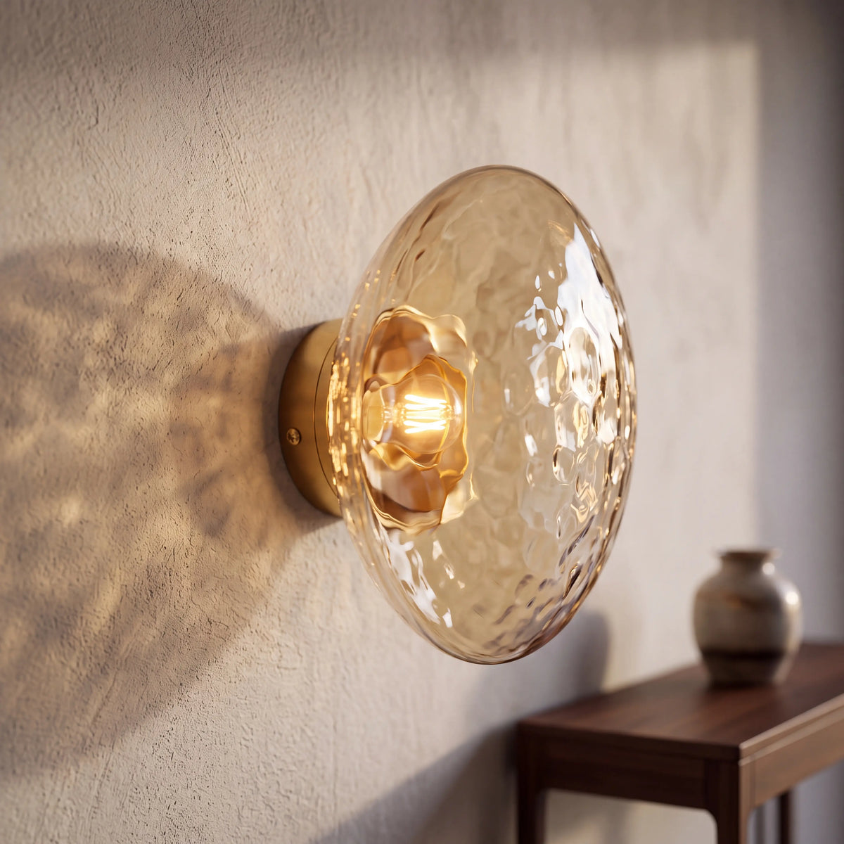 Gold and amber dimpled glass wall sconce, flush style D15cm, wall mounted beside a UK bed