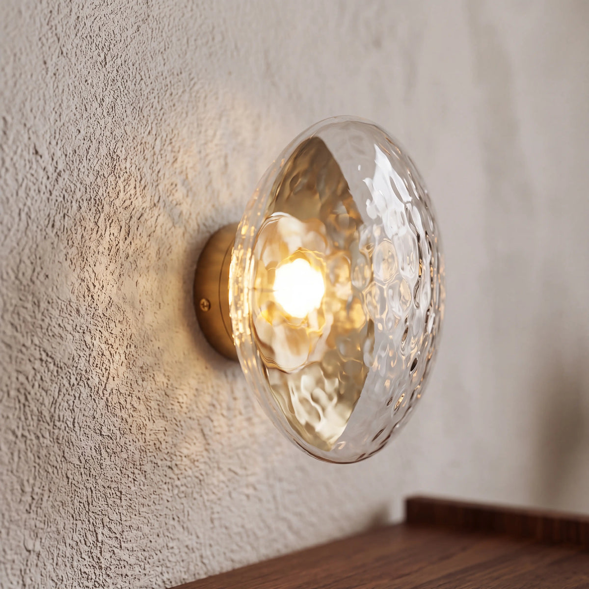 Gold and clear dimpled glass wall sconce, flush style D15cm, wall mounted in a UK hallway