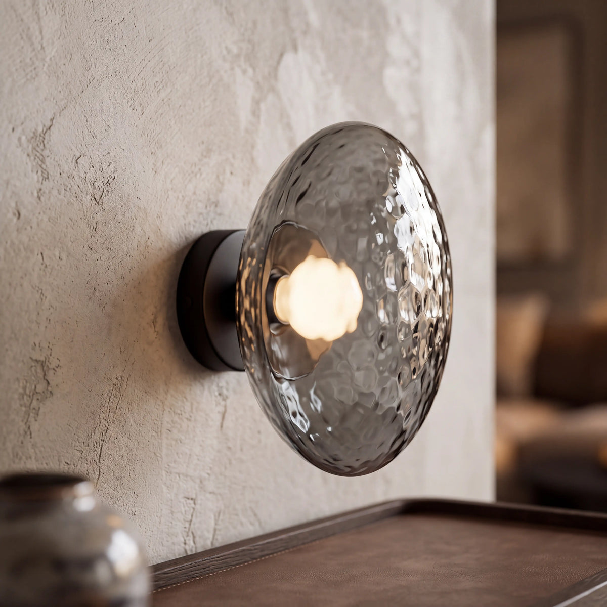 Black and grey dimpled glass wall sconce, flush style D15cm, wall mounted beside a UK staircase