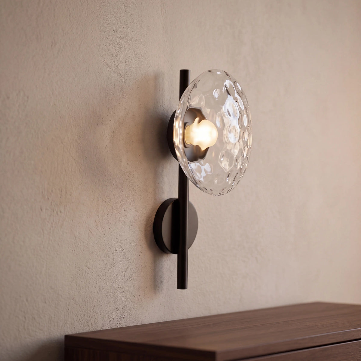 Black and clear dimpled glass wall sconce, rod style H40cm, wall mounted in a UK hallway