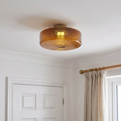 Amber ribbed glass flush ceiling light – 28cm – in a bedroom