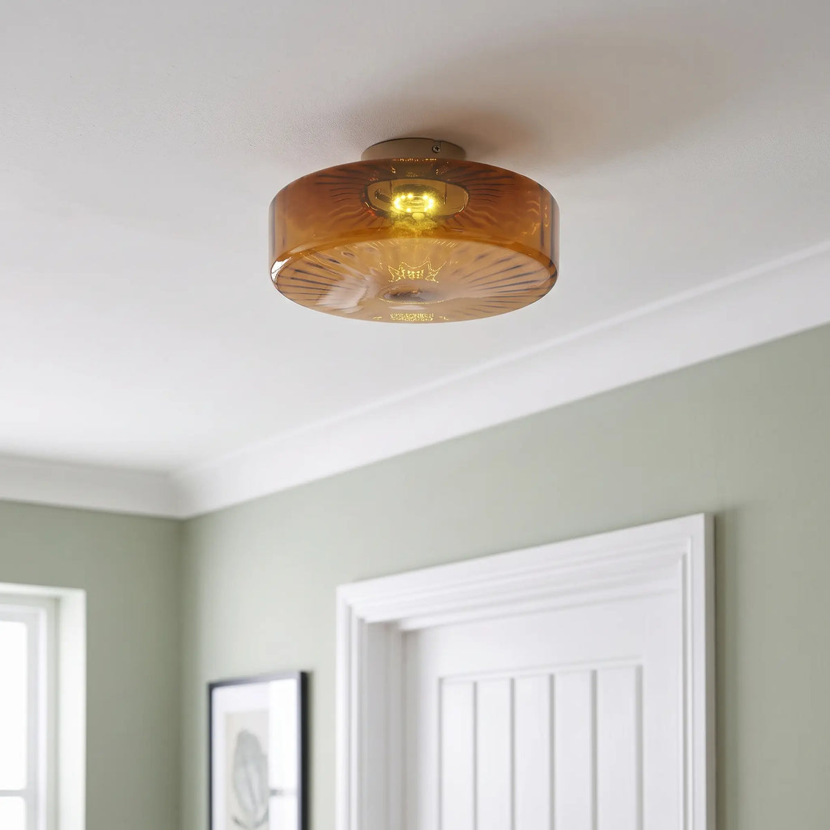 Amber ribbed glass flush ceiling light – 20cm – in a hallway