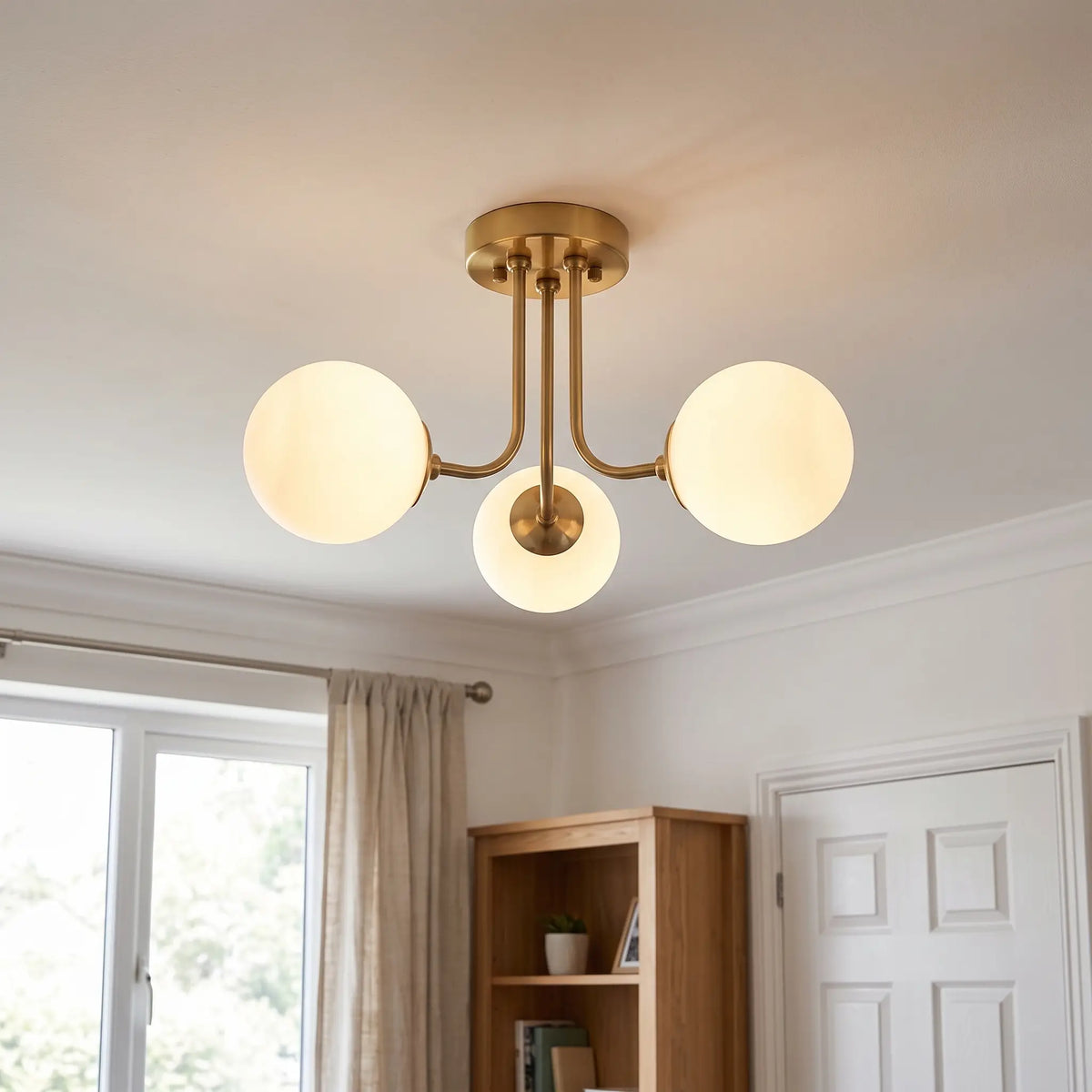 Opal glass globe semi flush chandelier – Gold – 3 Globes – in a living room